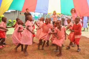 Happy children with Nasio volunteers
