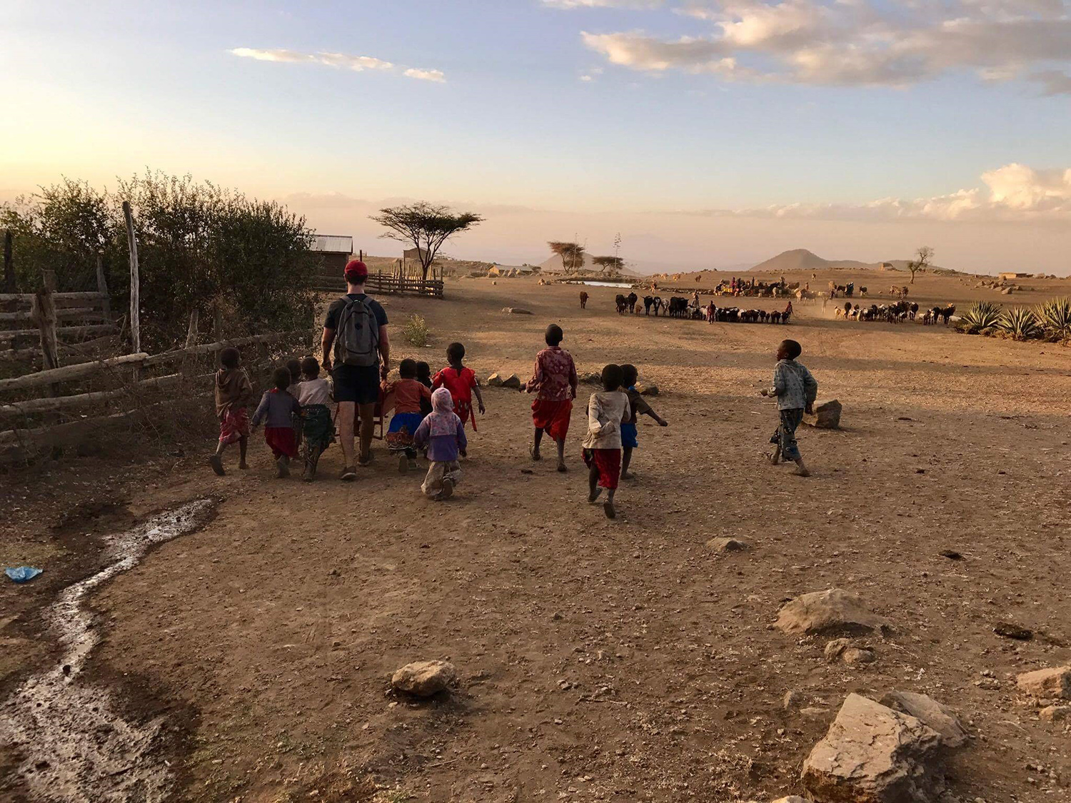 children playing with Nasio volunteer children playing with Nasio volunteer